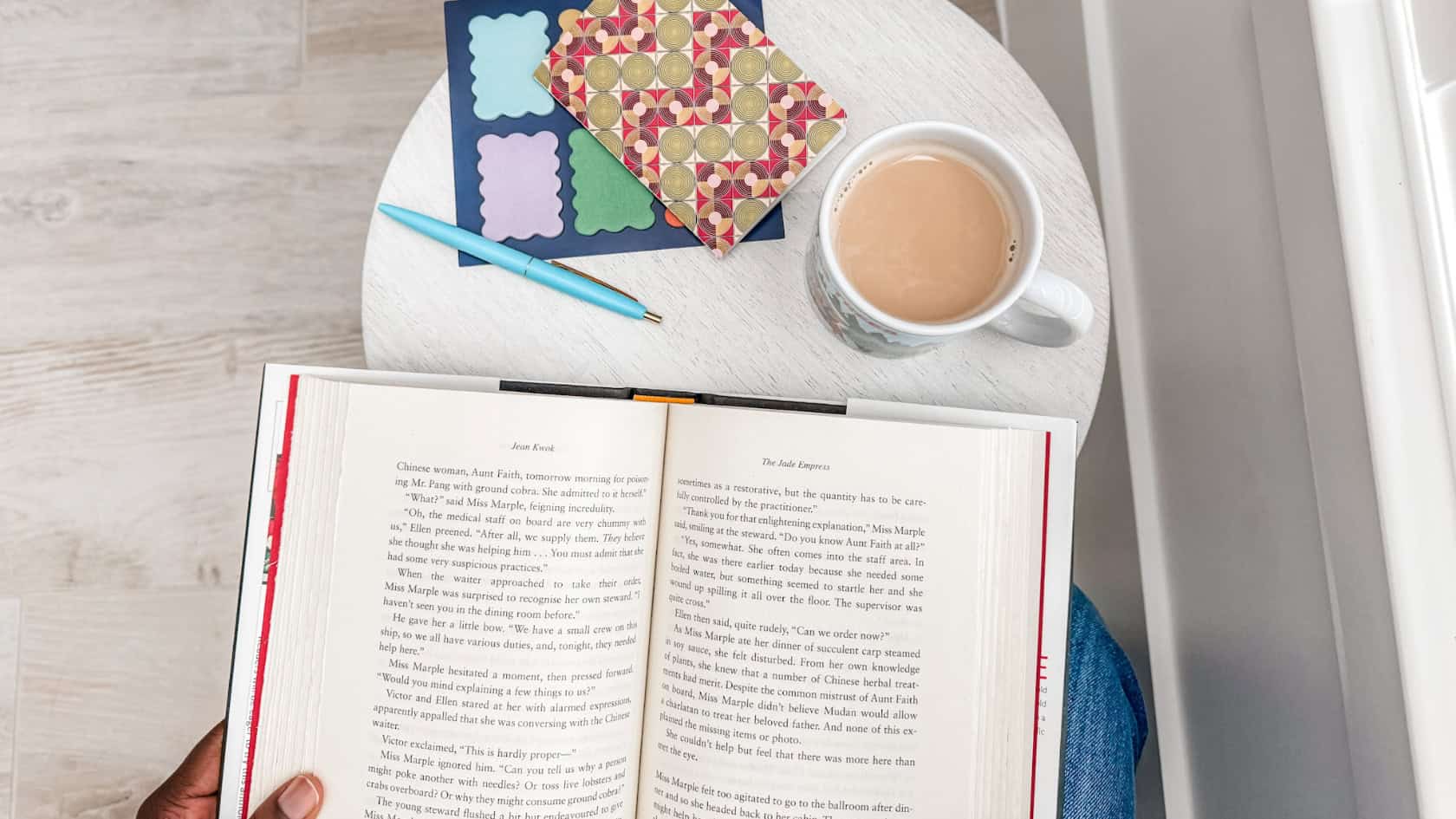 morning coffee ritual beside an open window and a book and coffee