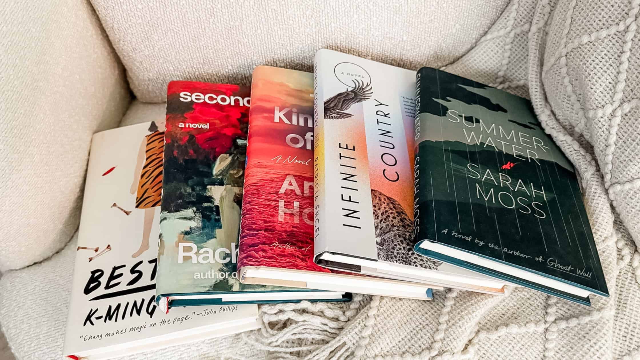Flatlay of five books from the list of short backlist literary fiction books to add to your reading list