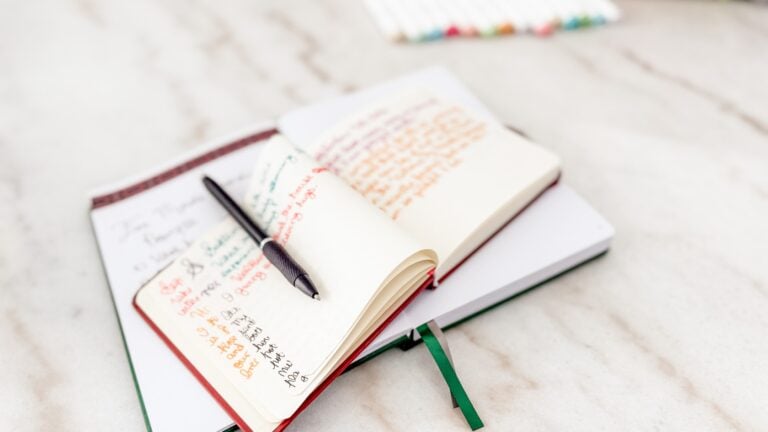 my five-minute evening journaling ritual with a notebook, and pen on my dining room table